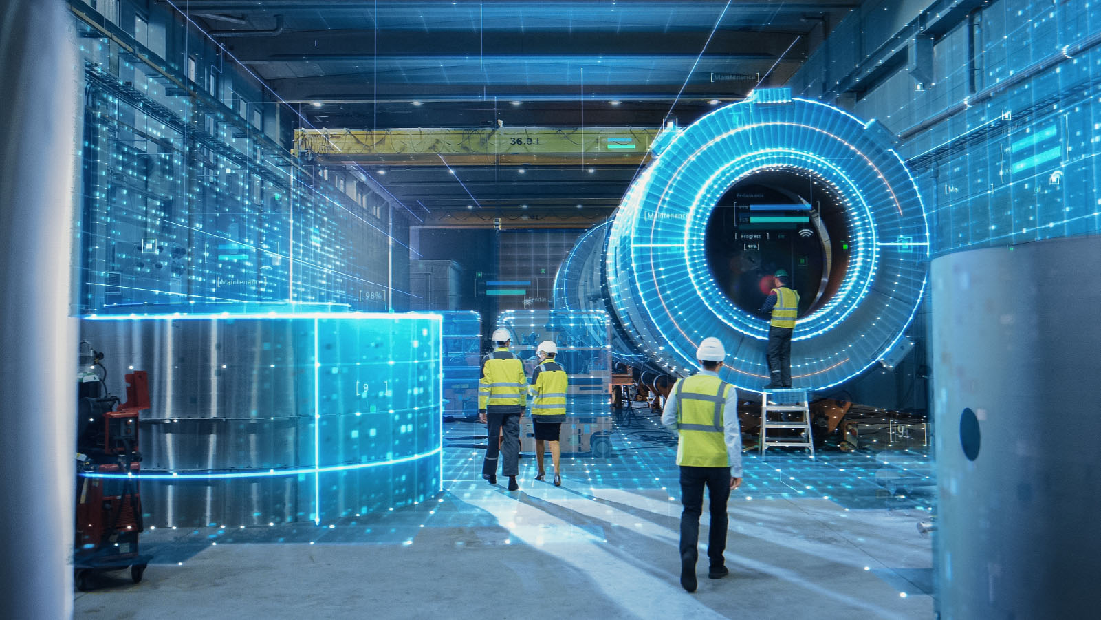 zespół inżynierów omawiający cyfrowy plan budowy wokół stołu konferencyjnego